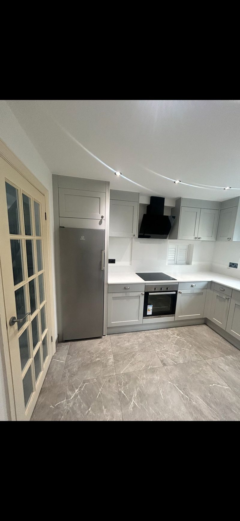 Grey kitchen with marble floor